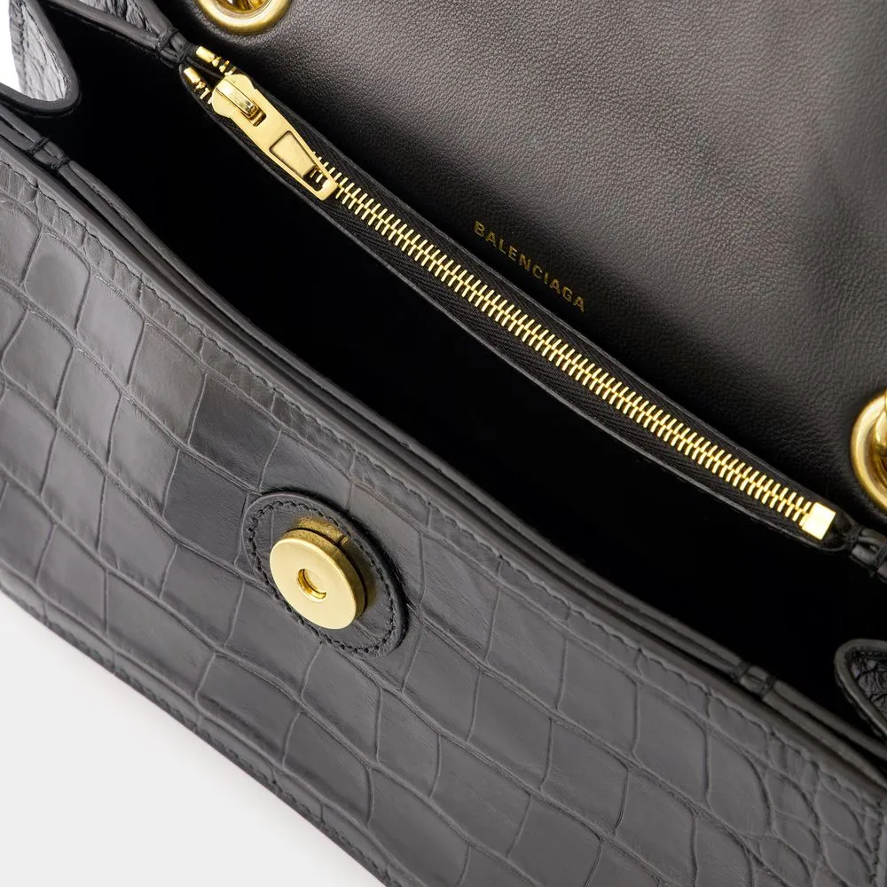 BALENCIAGA CRUSH CHAIN SMALL BAG IN CROCODILE-EMBOSSED LEATHER.? DIMENSIONS: L24.9 X H14 X W7.9 CM.? 49.8 CM LONG CHAIN SHOULDER STRAP.? CURVILINEAR BOTTOM.? AGED GOLD FINISH.? STUDDED MAGNET